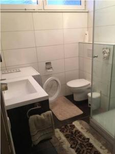 a bathroom with a sink and a toilet and a shower at Vasari Home in Meersburg