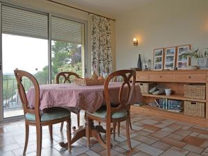 a dining room with a table and chairs and a window at Pretty villa with pool and jacuzzi in Carcassonne in Carcassonne