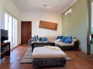 A television and/or entertainment centre at Holiday Home in Arenas with Private Pool