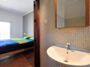 A bathroom at Holiday Home in Arenas with Private Pool