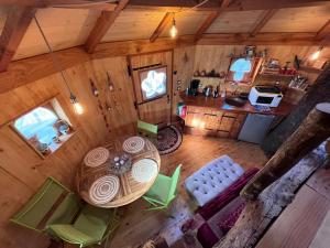 an overhead view of a room with a table and chairs at Les Cabanes de Brassac in Brassac