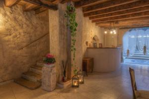 a living room with a staircase in a building at Corte Alma Spa and Luxury Home in Gargnano