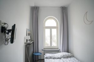 Postel nebo postele na pokoji v ubytování Moon Hostel Warszawa