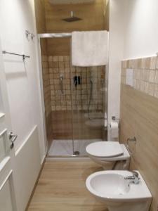 a bathroom with a shower and a toilet and a sink at Federico 70 Giada Economy in Palermo