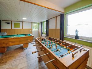 a billiard room with a pool table in it at Charming cottage with jacuzzi and sauna High Fens in Waimes
