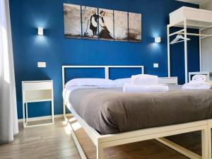 A bed or beds in a room at Central Rooms Matera