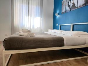 A bed or beds in a room at Central Rooms Matera