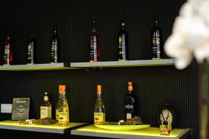 a row of bottles of wine on shelves at Pensiunea Kristall Tecuci in Tecuci