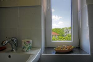 a bathroom with a sink and a window at Vila Brancoveanu in Eforie Sud +26 photos