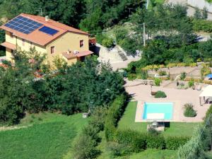 an aerial view of a house with a swimming pool at Belvilla by OYO Massarella Due in Fucecchio