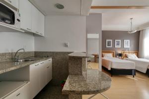 Cama ou camas em um quarto em Mercure Belo Horizonte Savassi