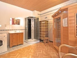 a bathroom with a shower and a sink at Heritage villa with home cinema sauna in Treuen