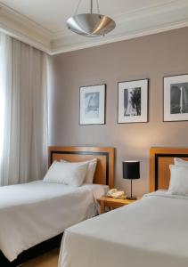 Cama ou camas em um quarto em Mercure Belo Horizonte Savassi
