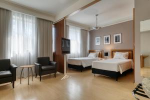 Cama ou camas em um quarto em Mercure Belo Horizonte Savassi