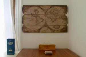 a map of the world hanging on a wall at Lothian Road - Castle View Apartment in Edinburgh