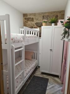 Postel nebo postele na pokoji v ubytování Casa Veiga 1