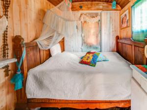 a bedroom with a bed with a canopy at Holiday Home in Houffalize With Terrace in Houffalize