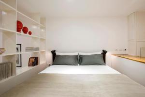 Łóżko lub łóżka w pokoju w obiekcie Cozy Loft @ Monti