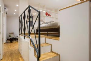 Łóżko lub łóżka w pokoju w obiekcie Cozy Loft @ Monti