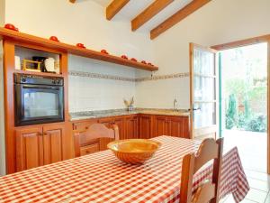 a kitchen with a table with a bowl on it at Belvilla by OYO Villa Campanet Vell in Campanet