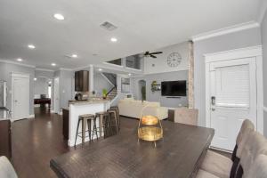 a kitchen and living room with a table and a living room at !!!KATY TEXAS GETaWAY!!! in Katy