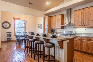 a kitchen with a large island with bar stools at Lodges 1193 in Mammoth Lakes