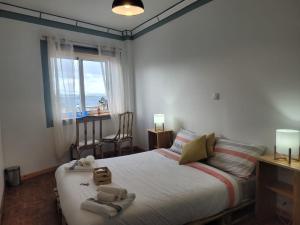 Кровать или кровати в номере The Handmade House Azores