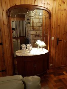 a bathroom with a sink and a mirror in a room at Chalet Malmedy in Malmedy