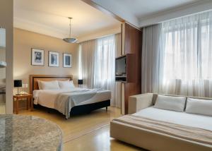 Cama ou camas em um quarto em Mercure Belo Horizonte Savassi