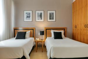 Cama ou camas em um quarto em Mercure Belo Horizonte Savassi