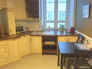 Kuchyňa alebo kuchynka v ubytovaní Poznańska Street Apartment