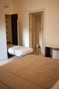 Postel nebo postele na pokoji v ubytování CasaPaola b&b Rooms