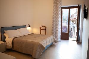 Postel nebo postele na pokoji v ubytování CasaPaola b&b Rooms + 37 fotografií