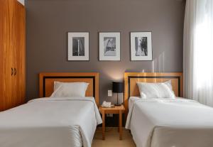 Cama ou camas em um quarto em Mercure Belo Horizonte Savassi