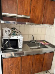 Kuchyň nebo kuchyňský kout v ubytování Portillo Apartments