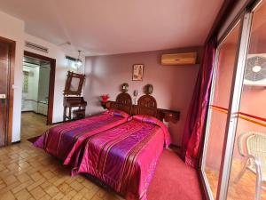 Postel nebo postele na pokoji v ubytování Hotel Tachfine