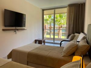 En eller flere senge i et værelse på Herdade dos Salgados - Vila das Lagoas - Private Apartaments