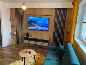 TV a/nebo společenská místnost v ubytování D&T by Tomazzo