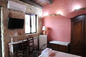 Postel nebo postele na pokoji v ubytování B&B Villa Giusy