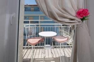 Ein Balkon oder eine Terrasse in der Unterkunft Residence Rimini Mare