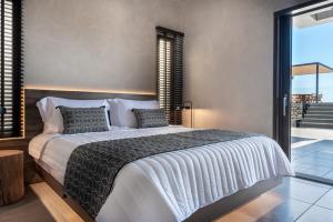 A bed or beds in a room at Ardor Exclusive Villas