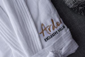A bed or beds in a room at Ardor Exclusive Villas