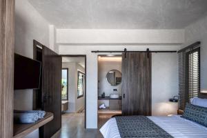 A bed or beds in a room at Ardor Exclusive Villas