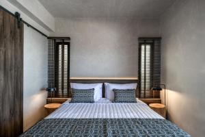 A bed or beds in a room at Ardor Exclusive Villas