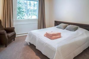 Katil atau katil-katil dalam bilik di Holiday Apartment Usva Kolmio