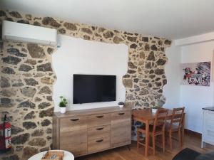 A television and/or entertainment centre at CASTRO - LA COLINA