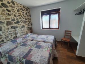 A bed or beds in a room at CASTRO - LA COLINA