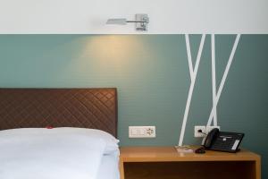 Krevet ili kreveti u jedinici u okviru objekta Hotel Schatzmann