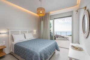 Postel nebo postele na pokoji v ubytování Owl Villas