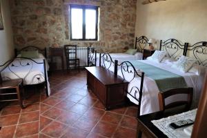 Postel nebo postele na pokoji v ubytování B&B Villa Giusy